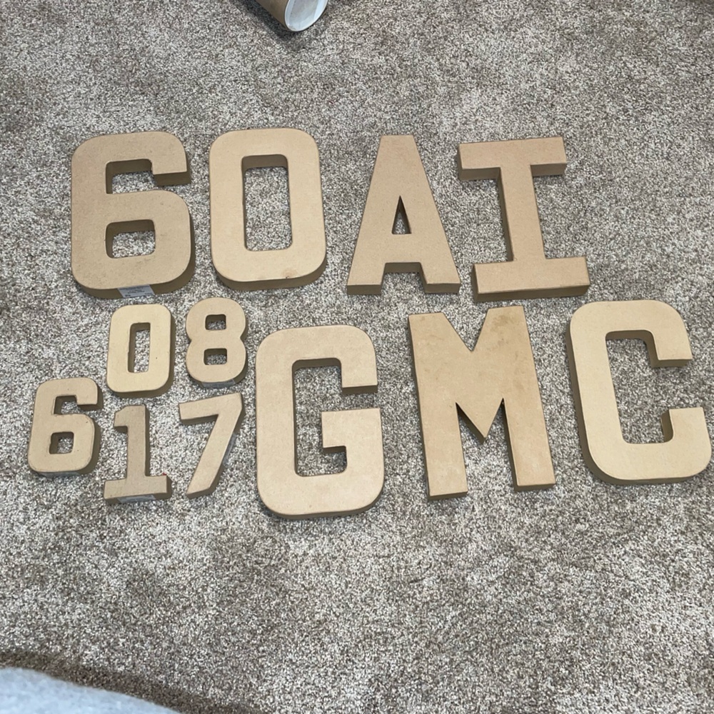 Assorted paper mache numbers and letters